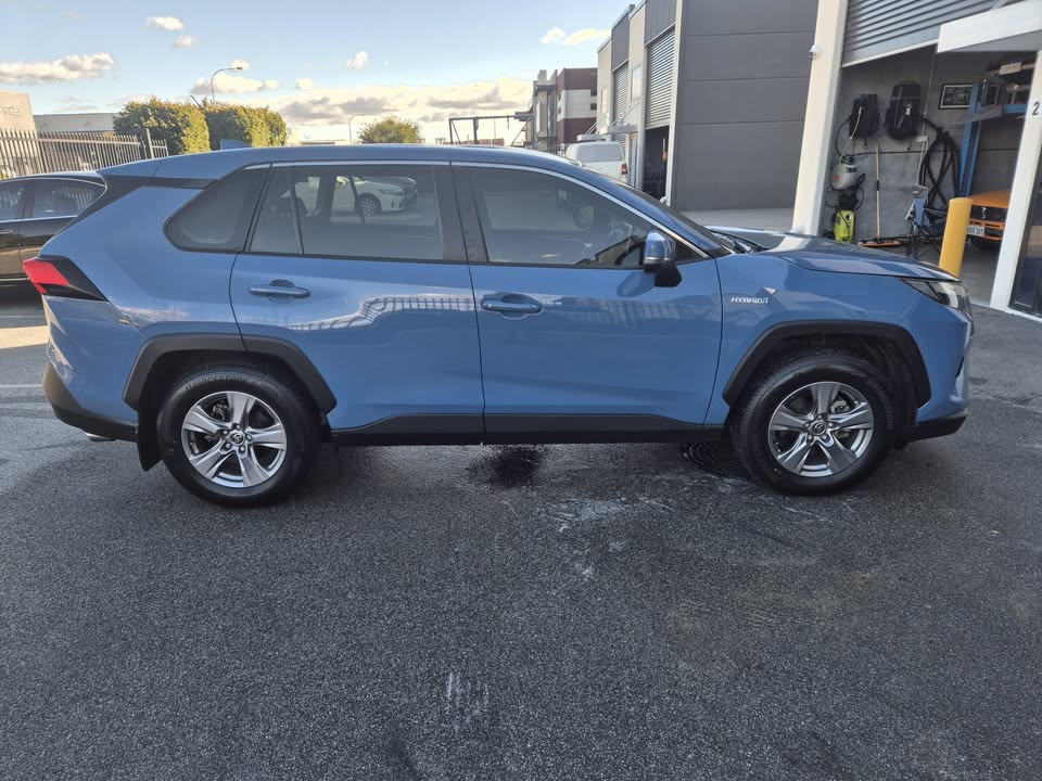 2023 Toyota RAV4 GX Hybrid in blue — photo 2 of 5