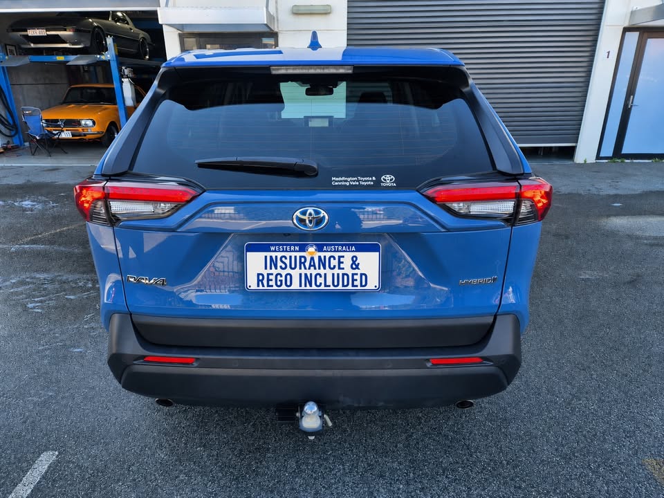 2023 Toyota RAV4 GX Hybrid in blue — photo 4 of 5
